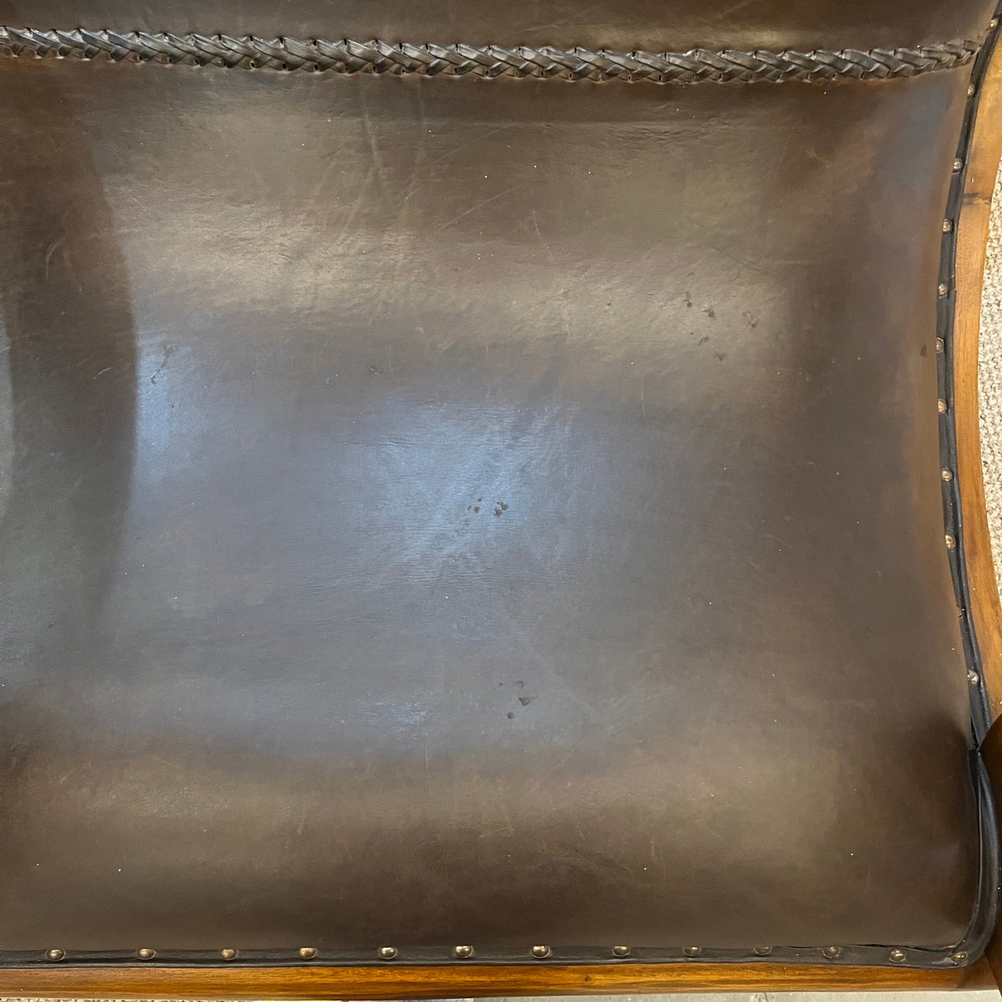 vintage-style leather-and-hardwood chair is inspired by classic British colonial and campaign furniture.