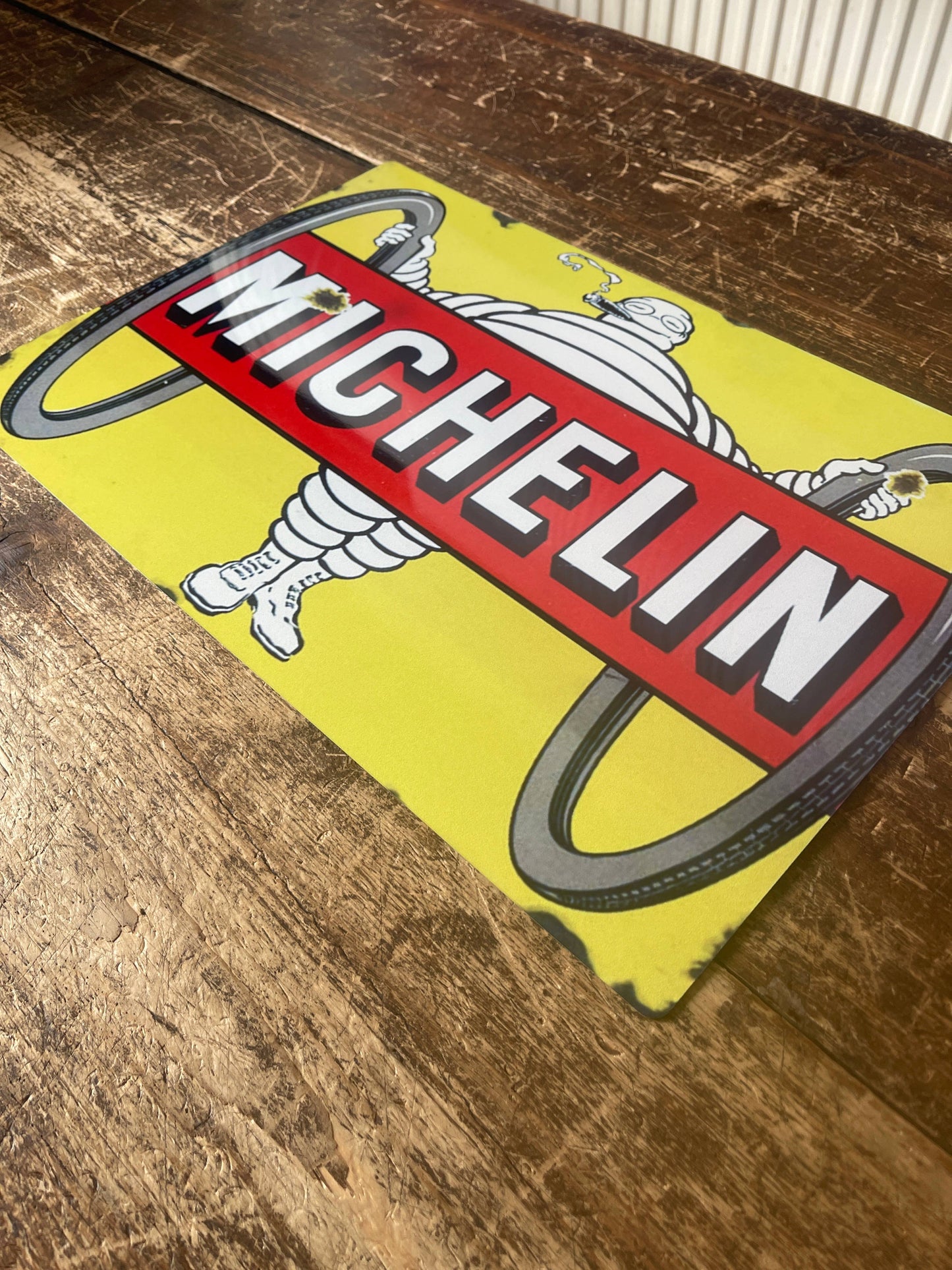 Vintage-Style Michelin logo Sign on a wooden surface, from Vintage Whippet