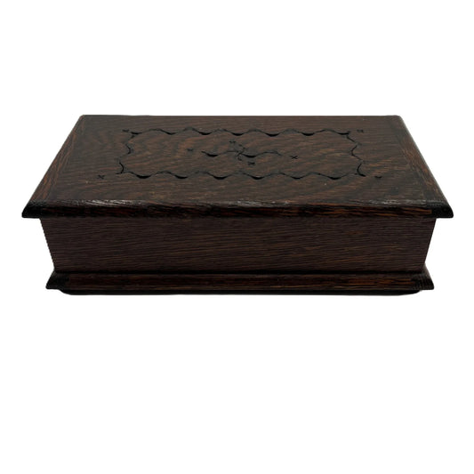 This is a vintage oak musical jewellery box made by Tallent of Old Bond Street, London, featuring a Swiss Reuge music box movement.