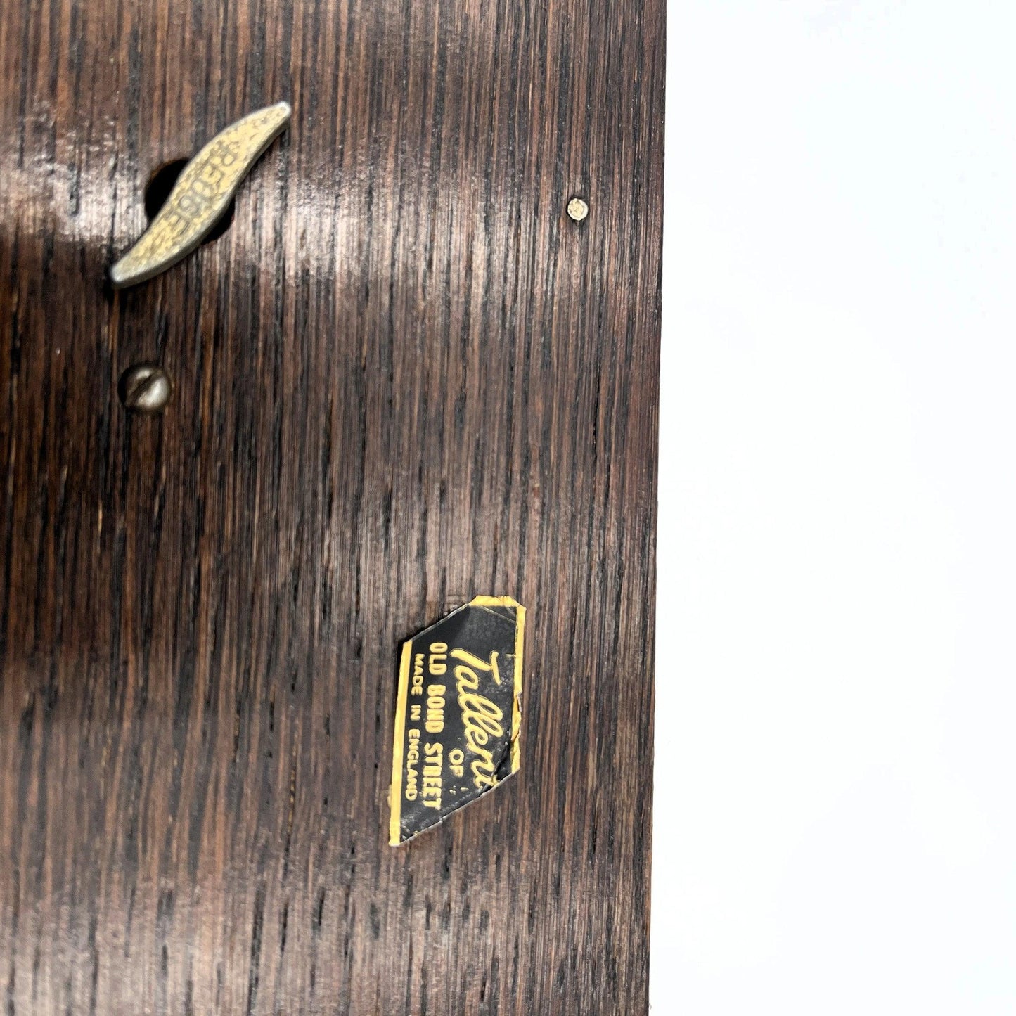 This is a vintage oak musical jewellery box made by Tallent of Old Bond Street, London, featuring a Swiss Reuge music box movement.