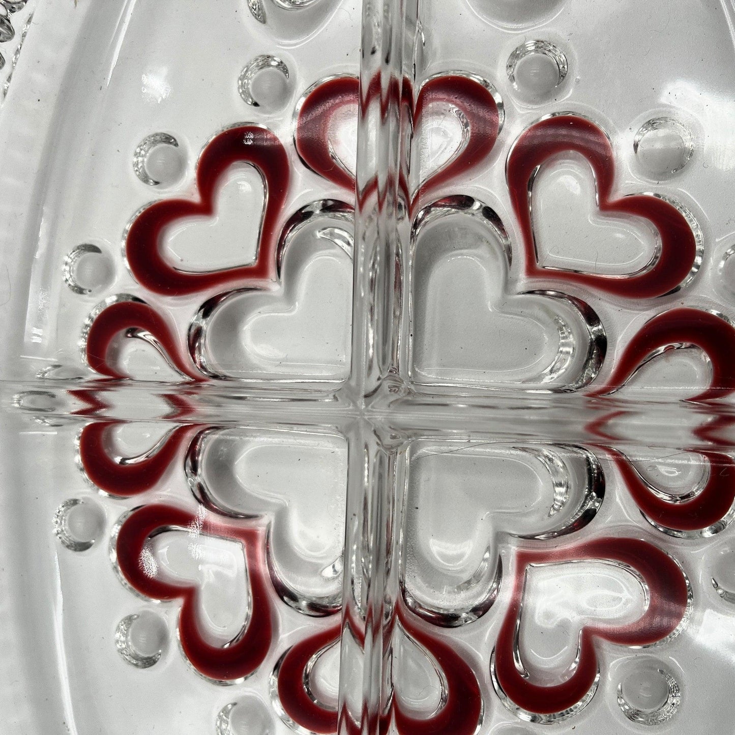 This is a vintage Walther Glas "Sweetheart" serving bowl, designed as a snack or sweets dish with a red heart and dot pattern. It is an oval, clear glass divided serving dish with a crimped edge.

