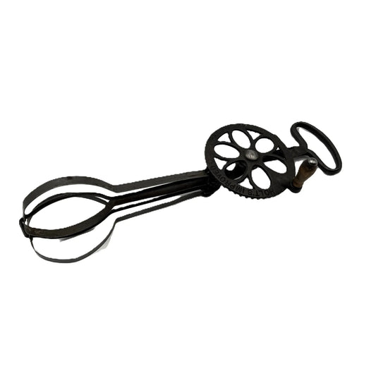 This is an Antique Holt's Egg Beater, made in the USA and patented in 1900. Impressed on the fly wheel with Holt's Improved, Pat. Aug. 22 1899. Apr 3 1900.