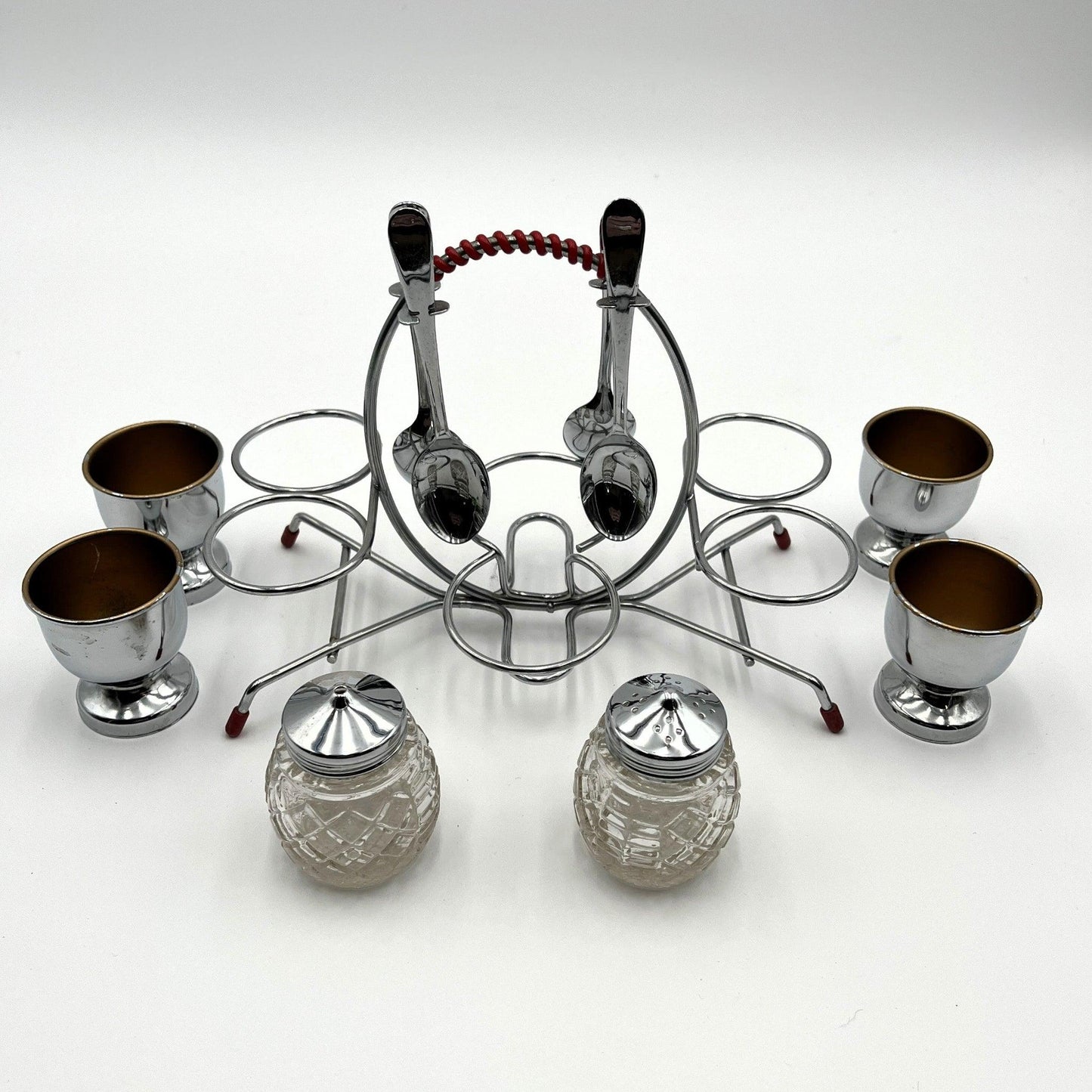 vintage 1960s egg cup holder with 4 egg cups, Salt and Pepper pots and 4 spoons. 