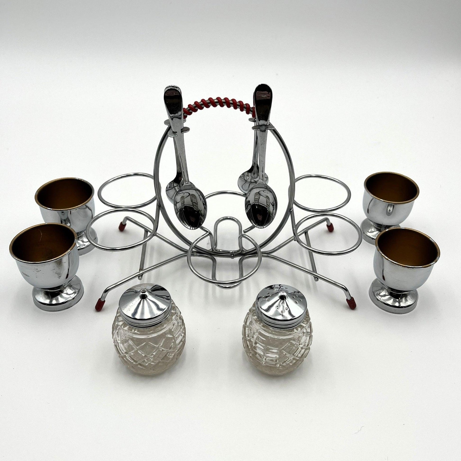 vintage 1960s egg cup holder with 4 egg cups, Salt and Pepper pots and 4 spoons. 