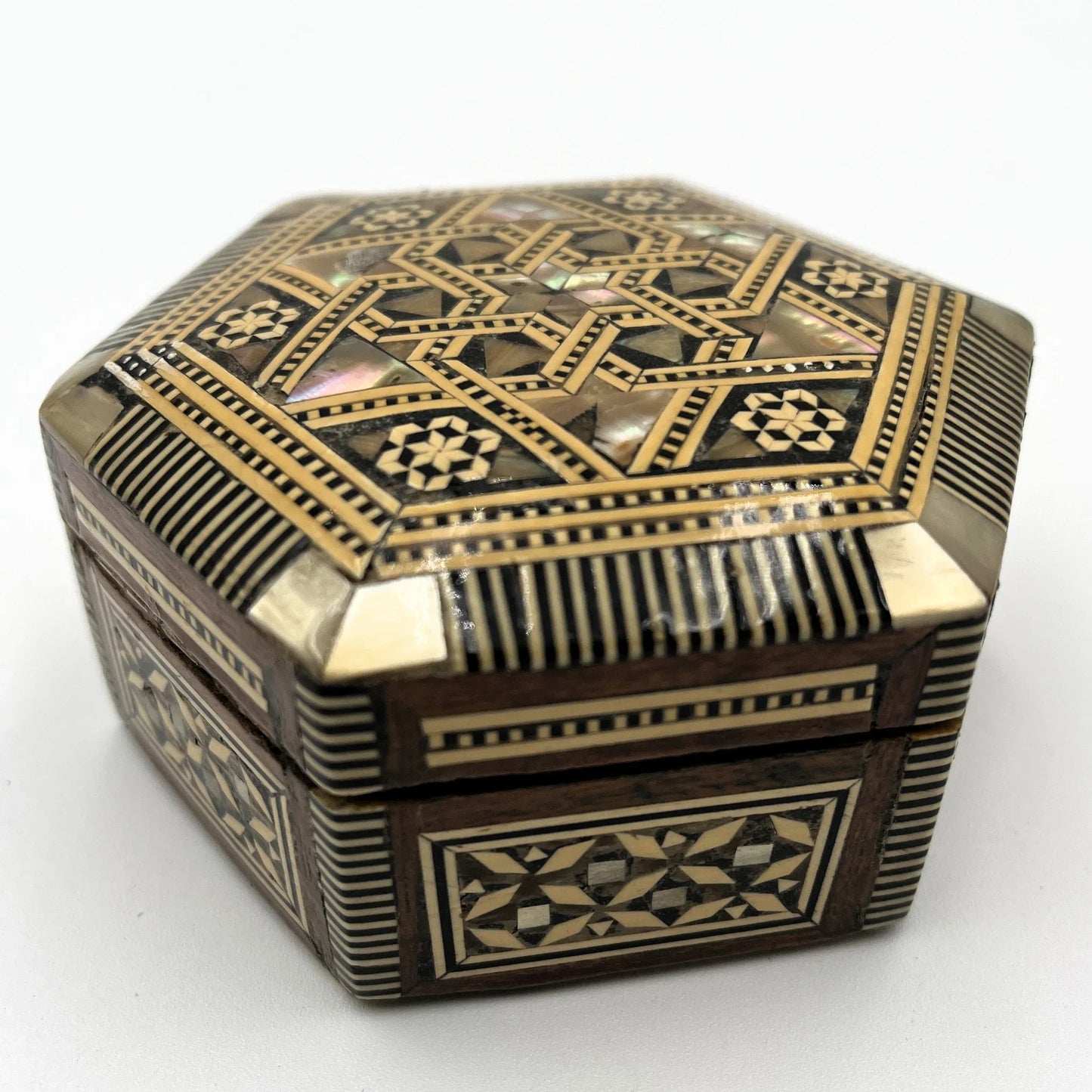 vintage hexagonal mosaic box, traditionally crafted in the Middle East with artisan techniques.