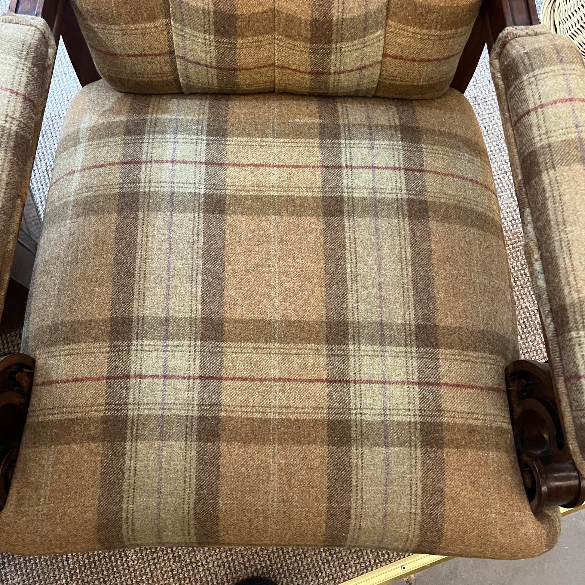 A handsome late Victorian mahogany open armchair, dating from the late 19th century, featuring beautifully carved scroll arms, turned front legs and original brass and ceramic castors.
