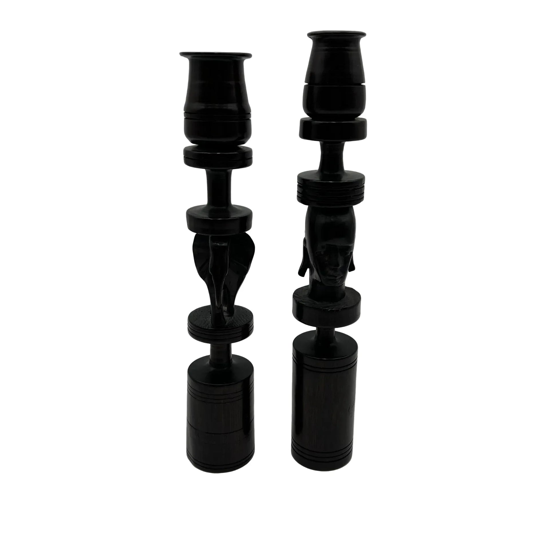 Pair of African black ebony candle holders with decorative carved elephant and face.