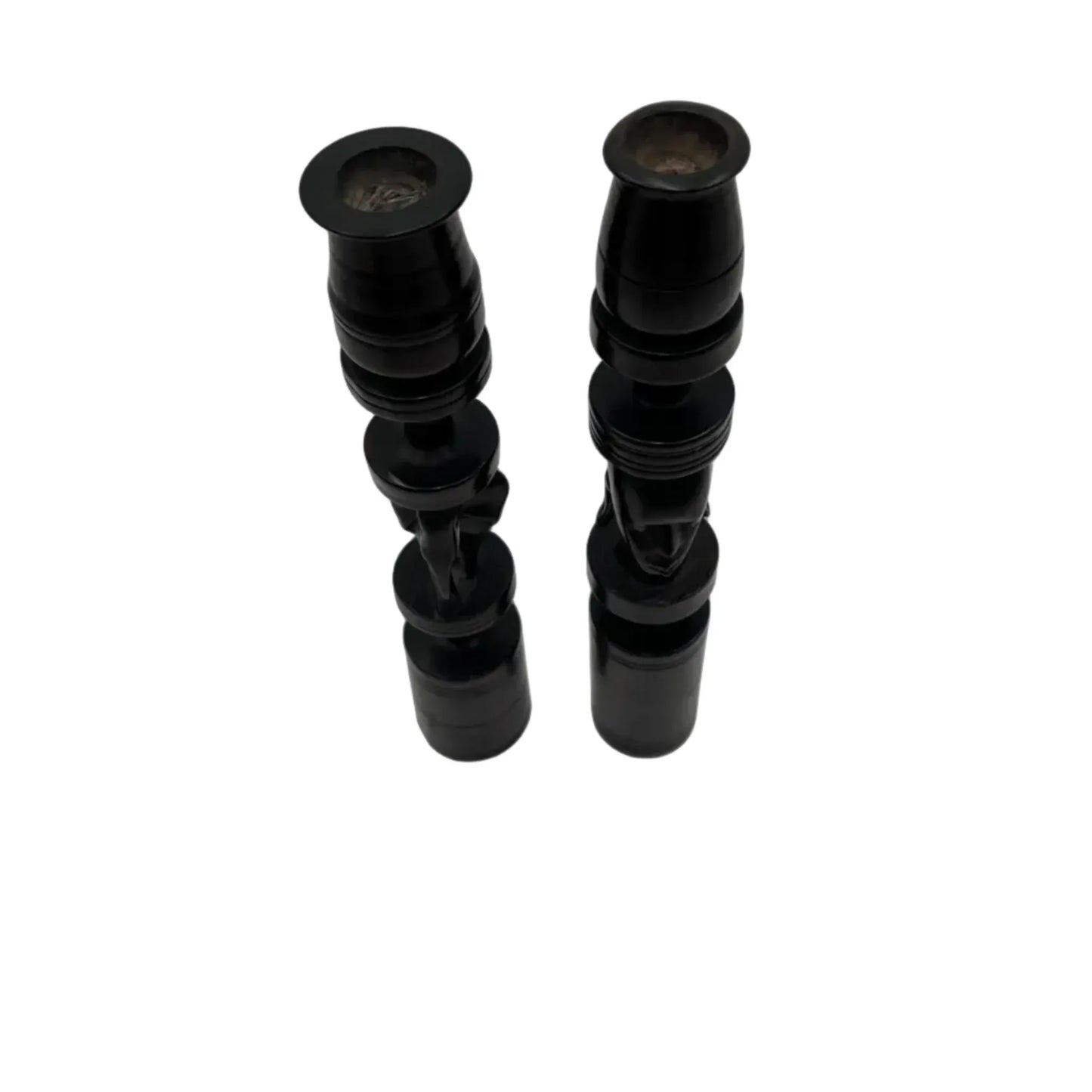 Pair of African black ebony candle holders with decorative carved elephant and face.