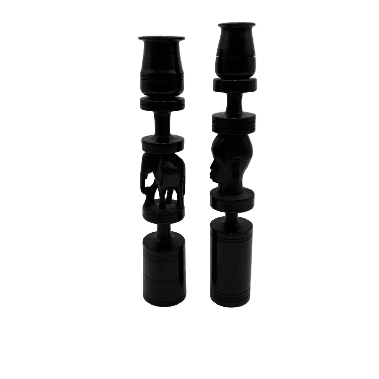 Pair of African black ebony candle holders with decorative carved elephant and face.