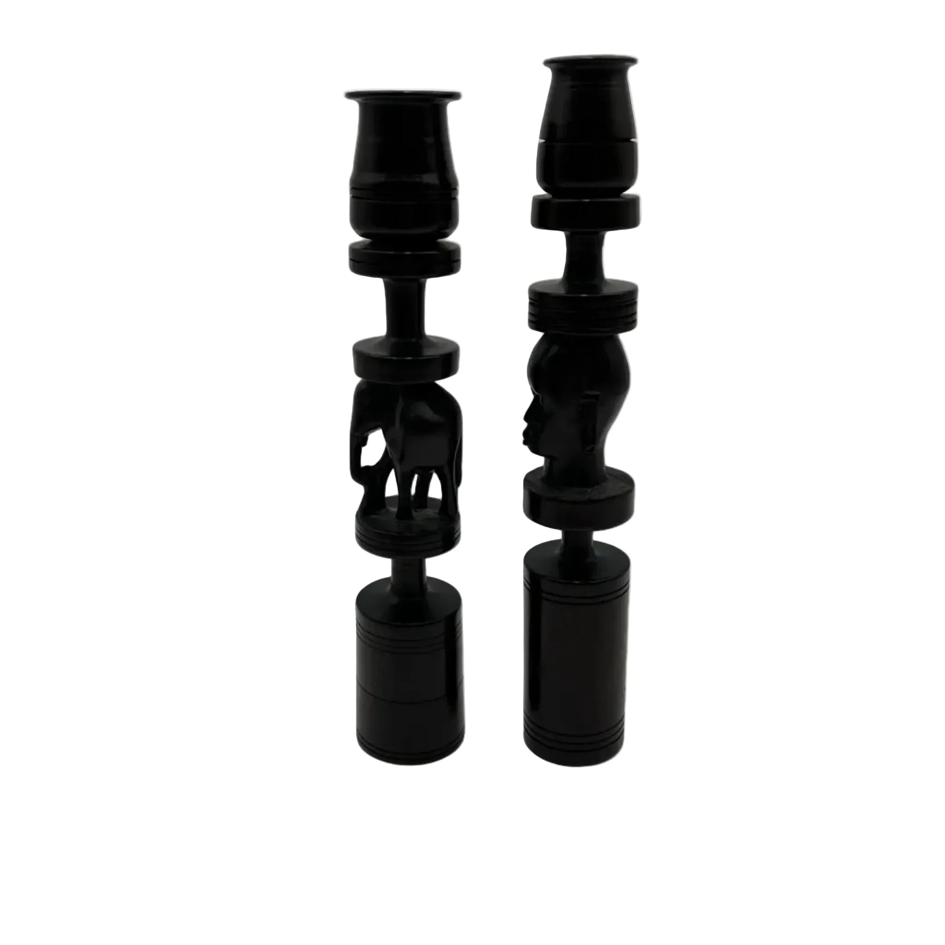 Pair of African black ebony candle holders with decorative carved elephant and face.