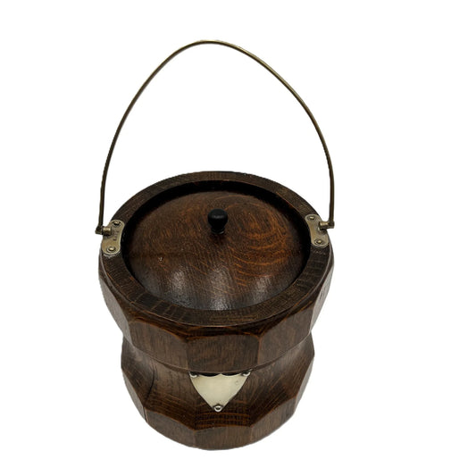 Antique English Oak Biscuit Barrel, sometimes used as an Ice Bucket. It has a white porcelain liner, which is in good condition.