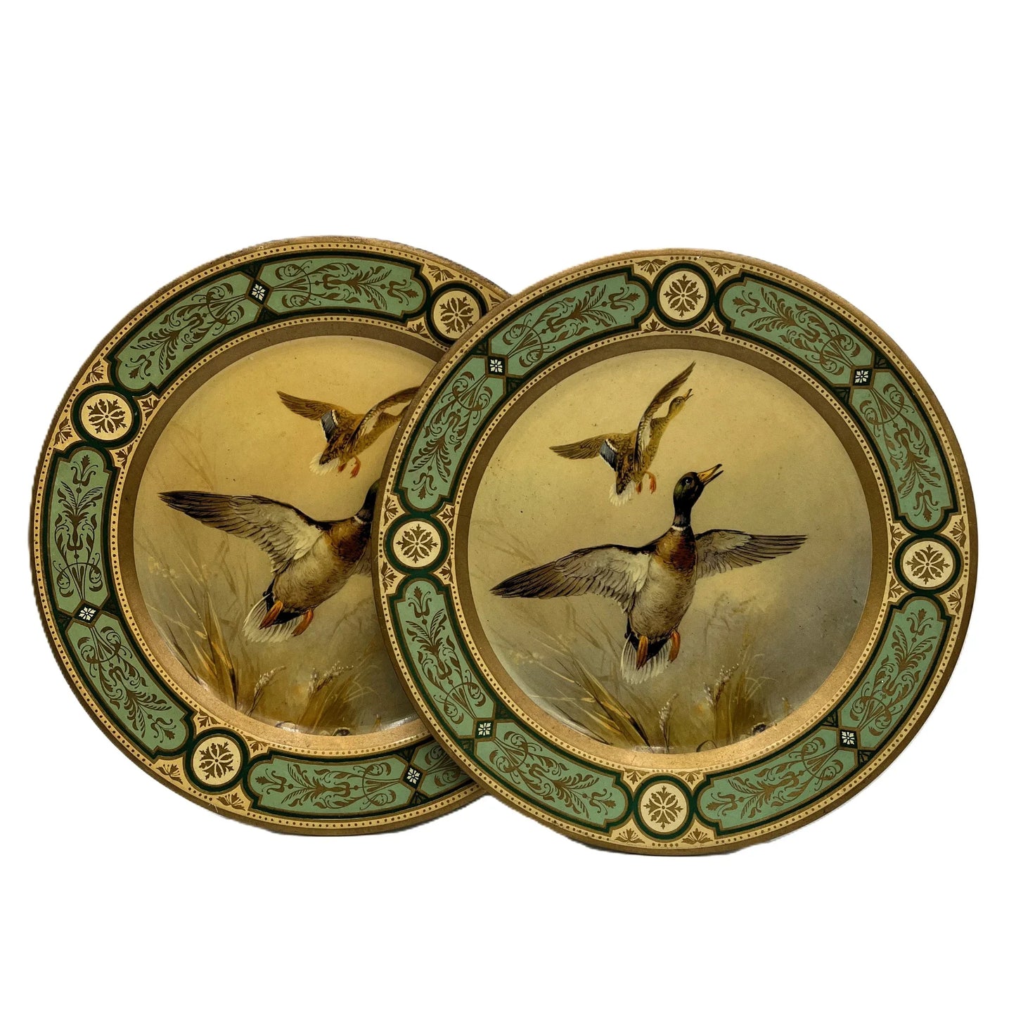 These are vintage Baret Ware tin lithograph decorative plates featuring a beautiful design of mallard ducks in flight
