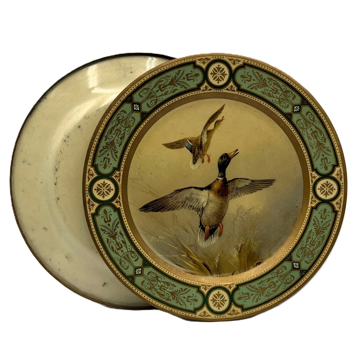 These are vintage Baret Ware tin lithograph decorative plates featuring a beautiful design of mallard ducks in flight