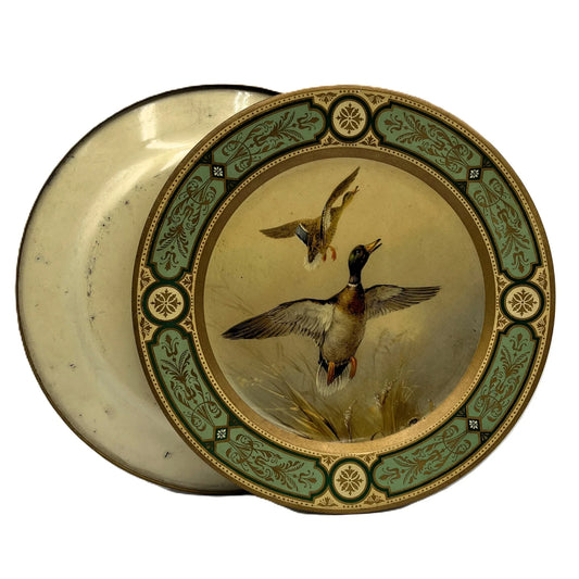 These are vintage Baret Ware tin lithograph decorative plates featuring a beautiful design of mallard ducks in flight