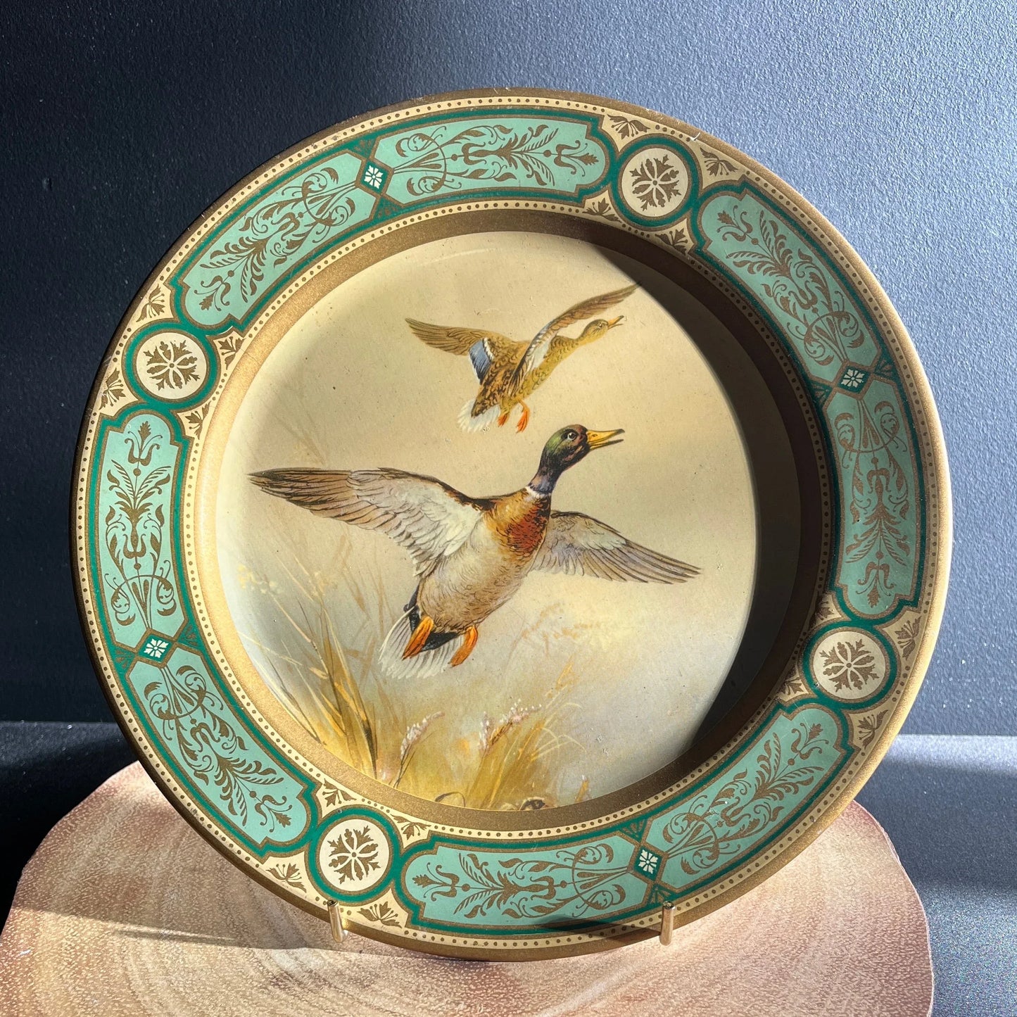 These are vintage Baret Ware tin lithograph decorative plates featuring a beautiful design of mallard ducks in flight