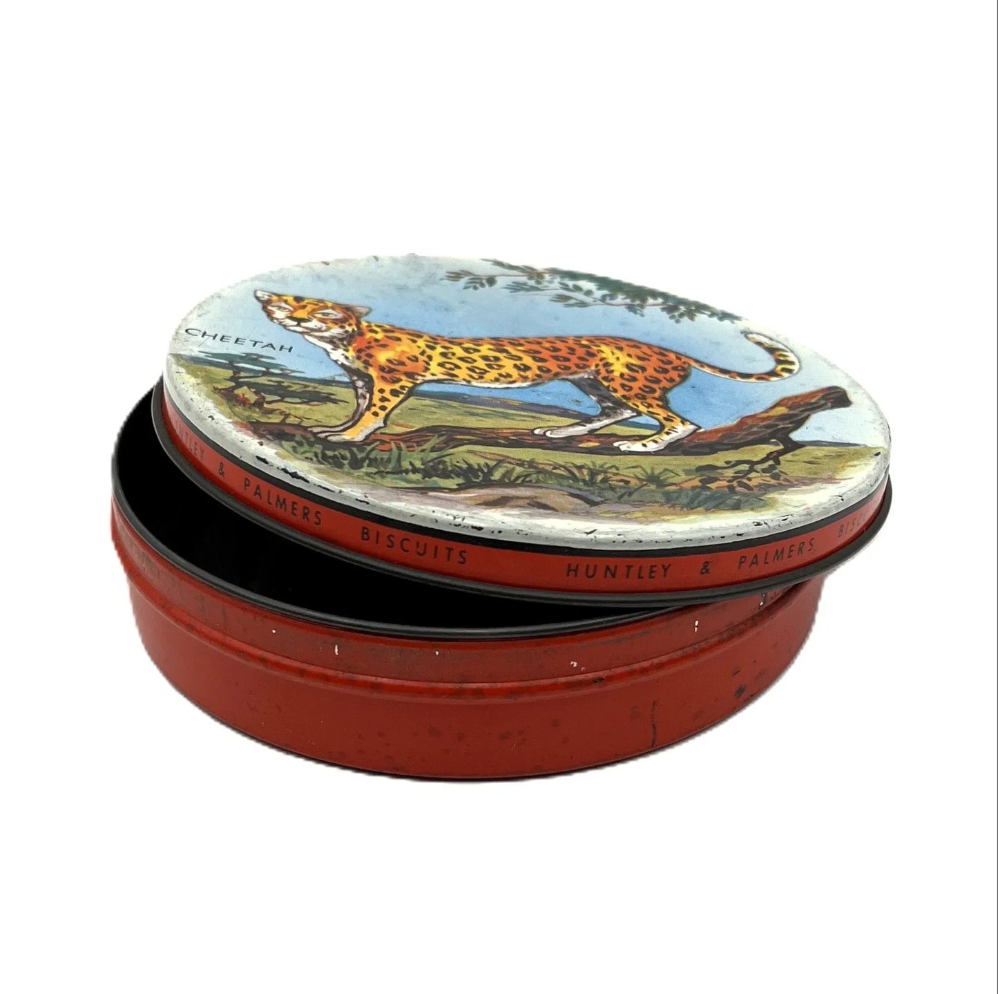 This is a smaller 1960s Huntley and Palmers biscuit tin, aimed at children with an image of, and the word Cheetah on the lid.