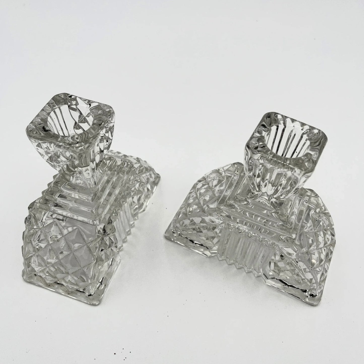 This is a Pair of Walther and Sohne 1930s-1940s Vintage Pressed Glass Candlesticks. 