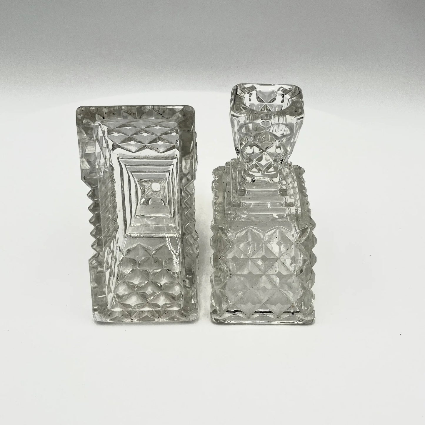This is a Pair of Walther and Sohne 1930s-1940s Vintage Pressed Glass Candlesticks. 