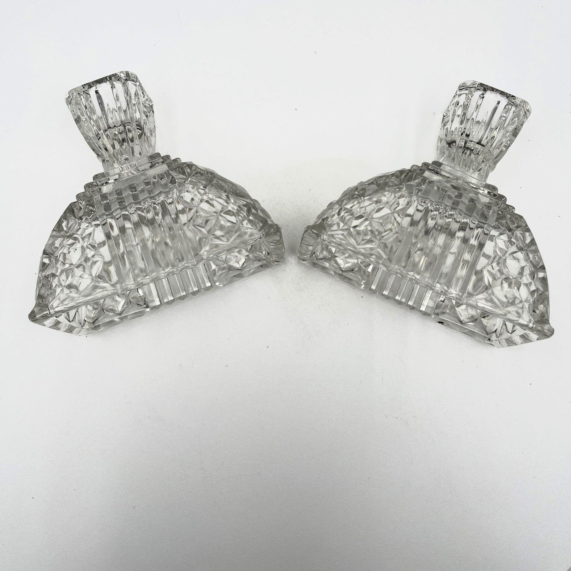 This is a Pair of Walther and Sohne 1930s-1940s Vintage Pressed Glass Candlesticks. 