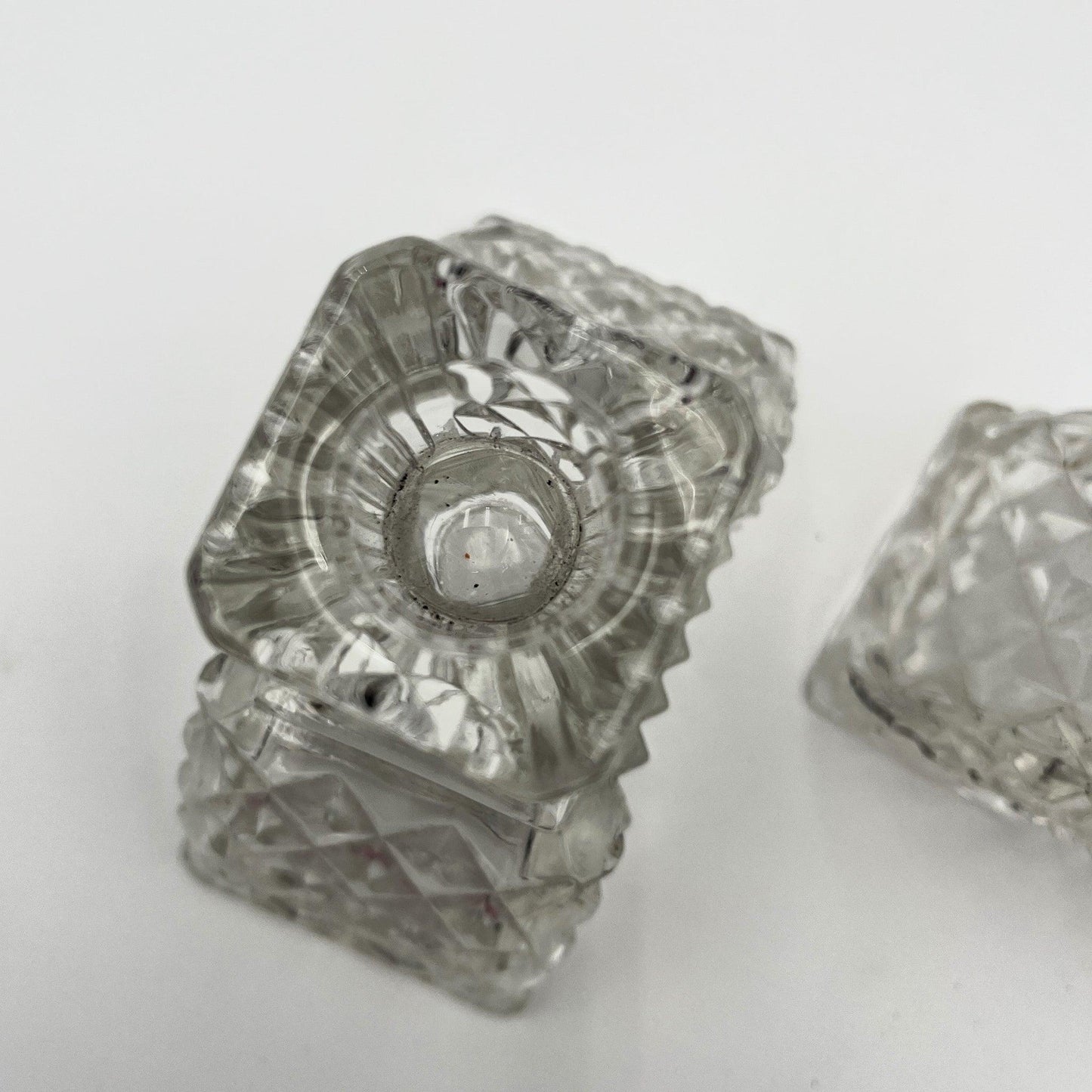 This is a Pair of Walther and Sohne 1930s-1940s Vintage Pressed Glass Candlesticks. 