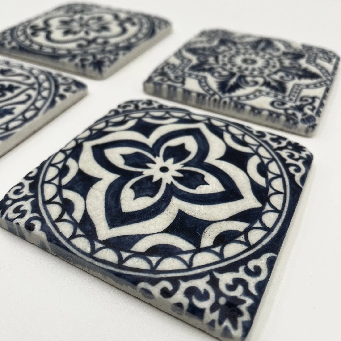 A set of 4 Vintage-style Ceramic Blue Tile Pattern, cork-backed coasters. Inspired by traditional Portuguese and Moroccan patterns