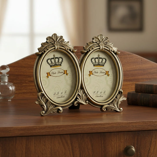 This is an elegant vintage-inspired double oval photo frame. Designed with ornate detailing and a distressed antique gold finish, this frame exudes timeless sophistication.