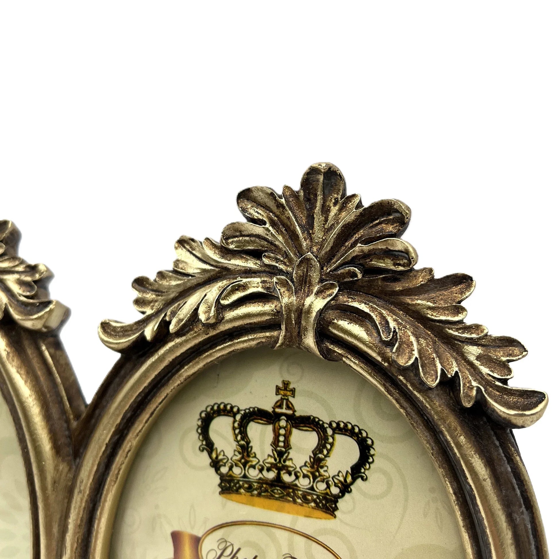 This is an elegant vintage-inspired double oval photo frame. Designed with ornate detailing and a distressed antique gold finish, this frame exudes timeless sophistication.