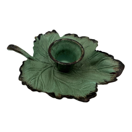 This is a Vintage-Inspired chamber stick candle holder. Made of metal this ivy leaf candle holder has a weathered, rustic, or distressed green patina finish with dark edges. 