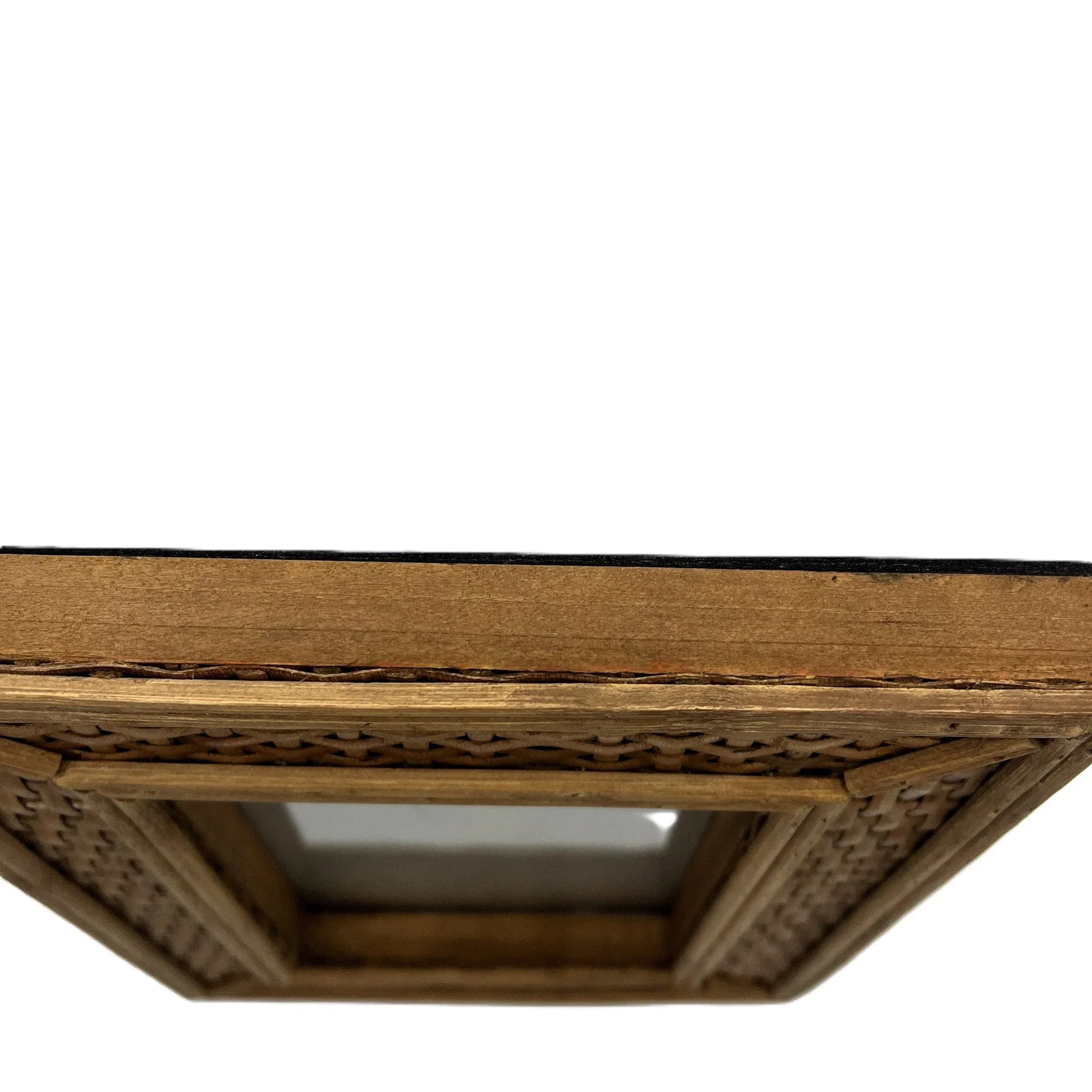 This frame, crafted from rattan, adds a touch of traditional country house charm to any home