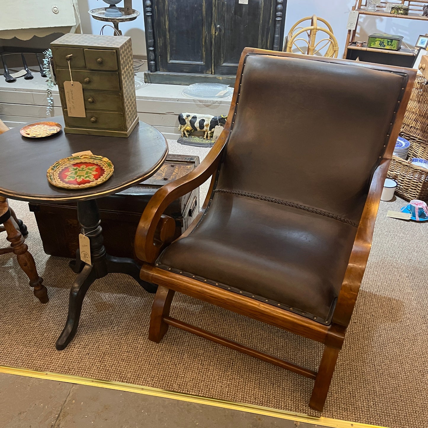 vintage-style leather-and-hardwood chair is inspired by classic British colonial and campaign furniture. 

