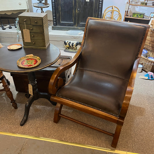 vintage-style leather-and-hardwood chair is inspired by classic British colonial and campaign furniture. 

