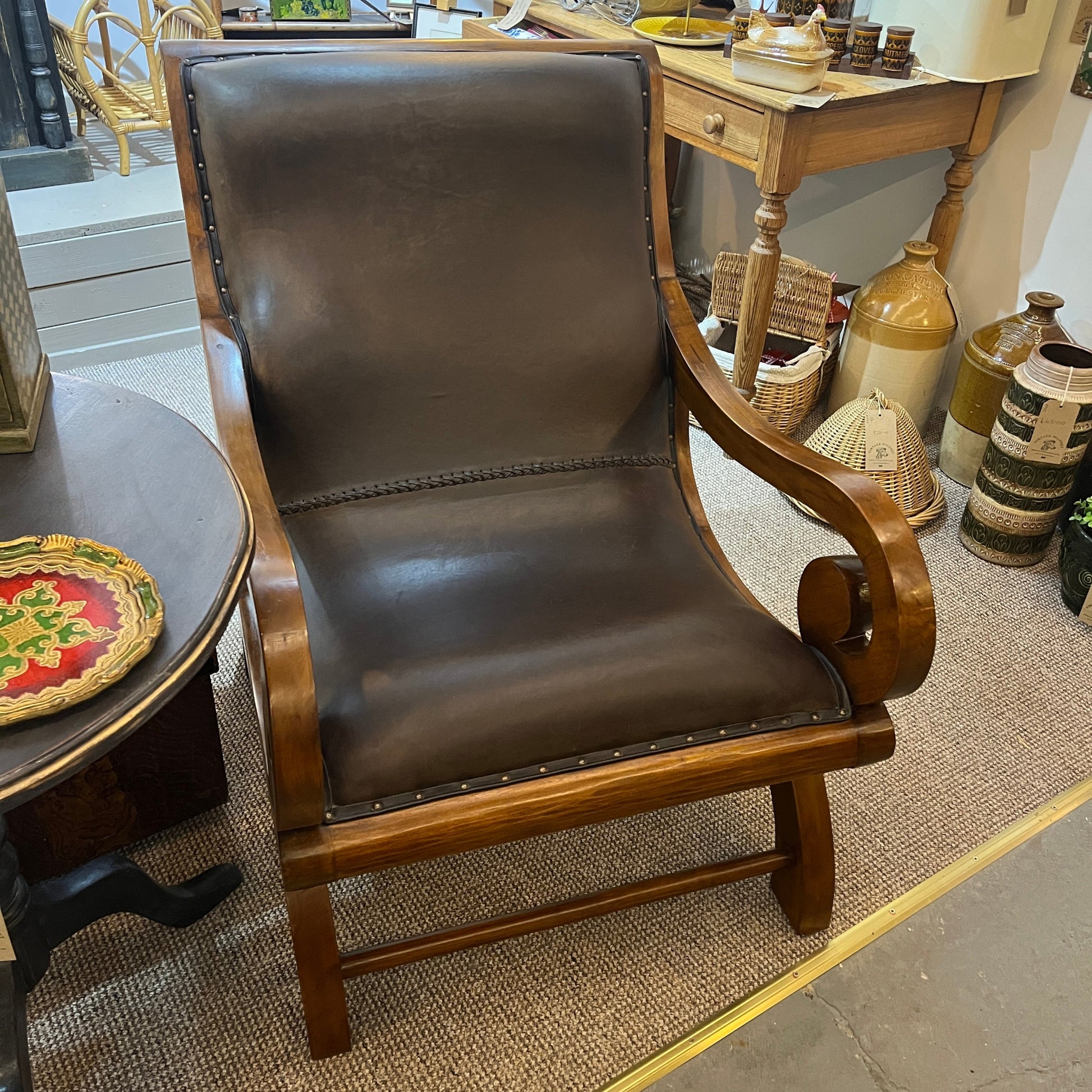 vintage-style leather-and-hardwood chair is inspired by classic British colonial and campaign furniture. 

