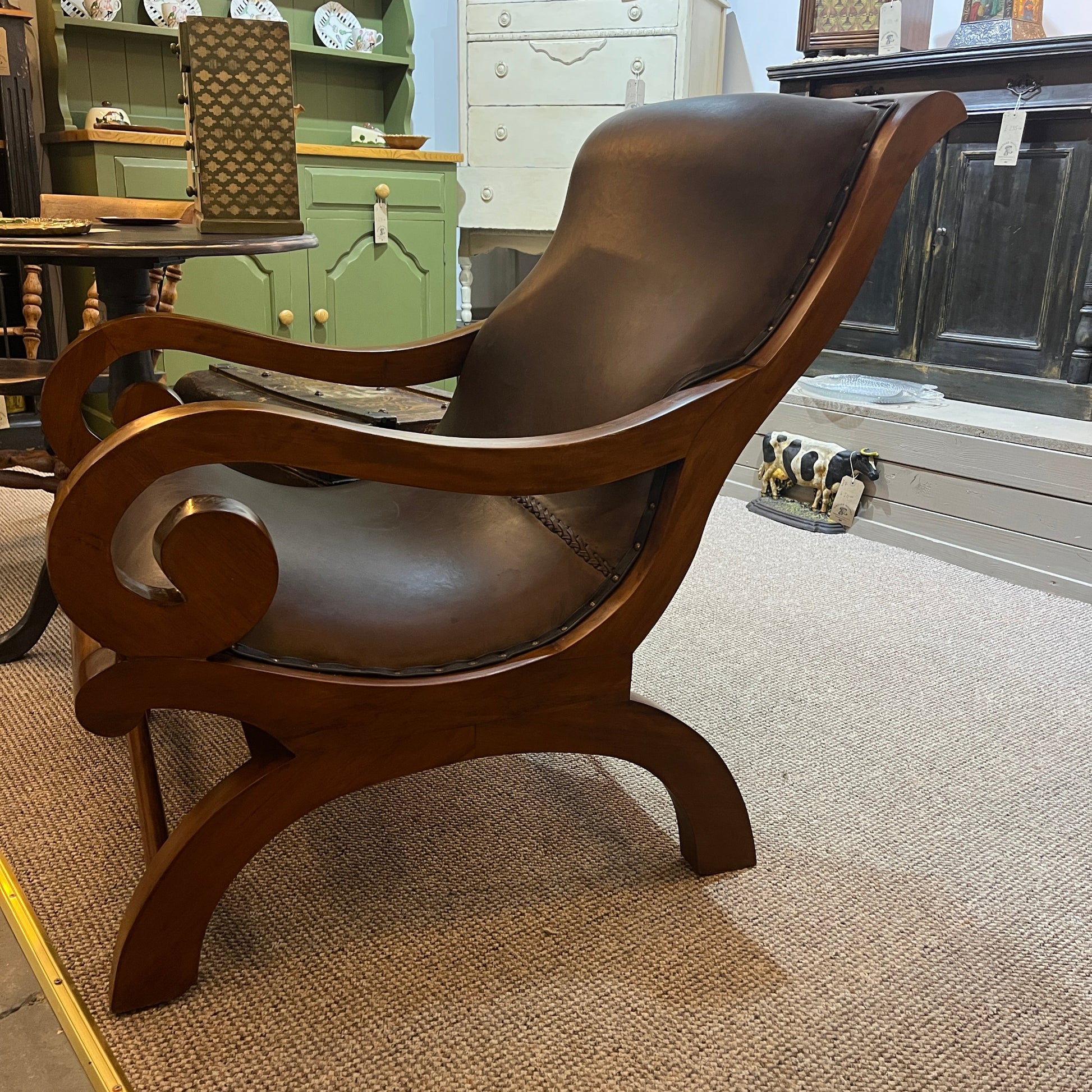 vintage-style leather-and-hardwood chair is inspired by classic British colonial and campaign furniture. 

