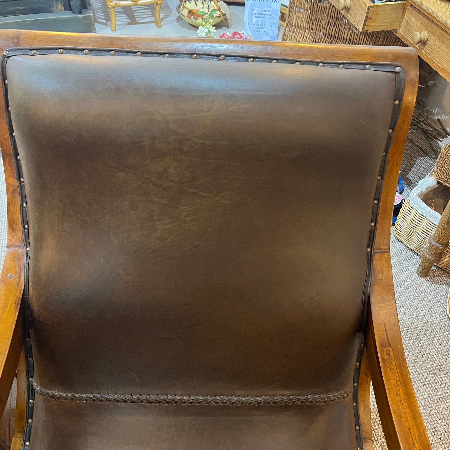 vintage-style leather-and-hardwood chair is inspired by classic British colonial and campaign furniture. 

