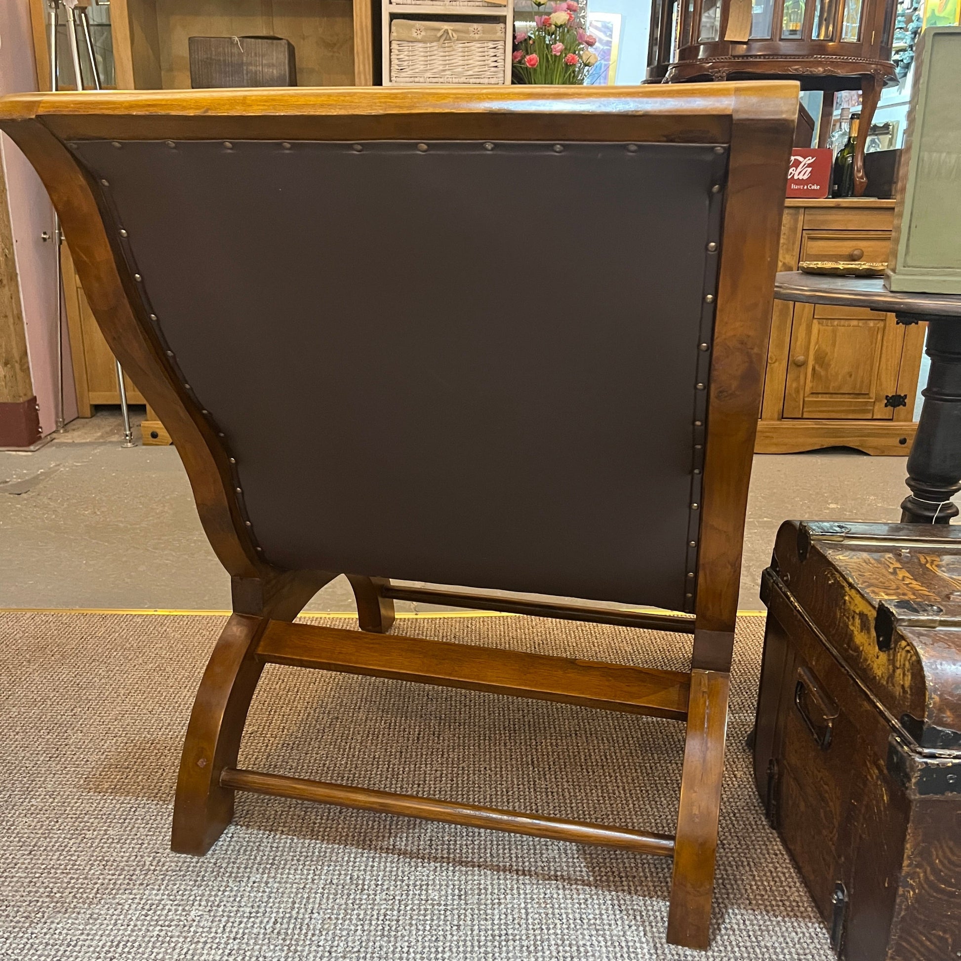 vintage-style leather-and-hardwood chair is inspired by classic British colonial and campaign furniture. 

