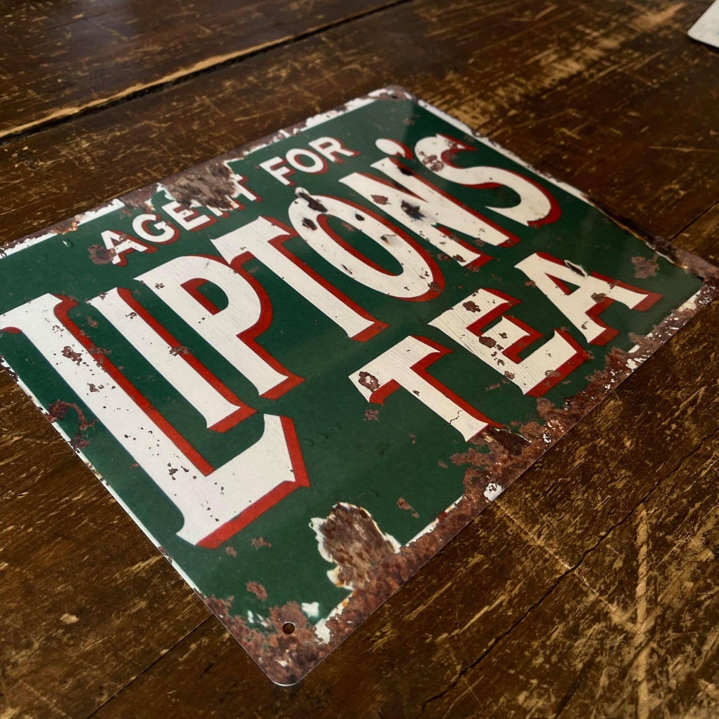 Vintage-Style Lipton's Tea sign on a wooden surface, from Vintage Whippet