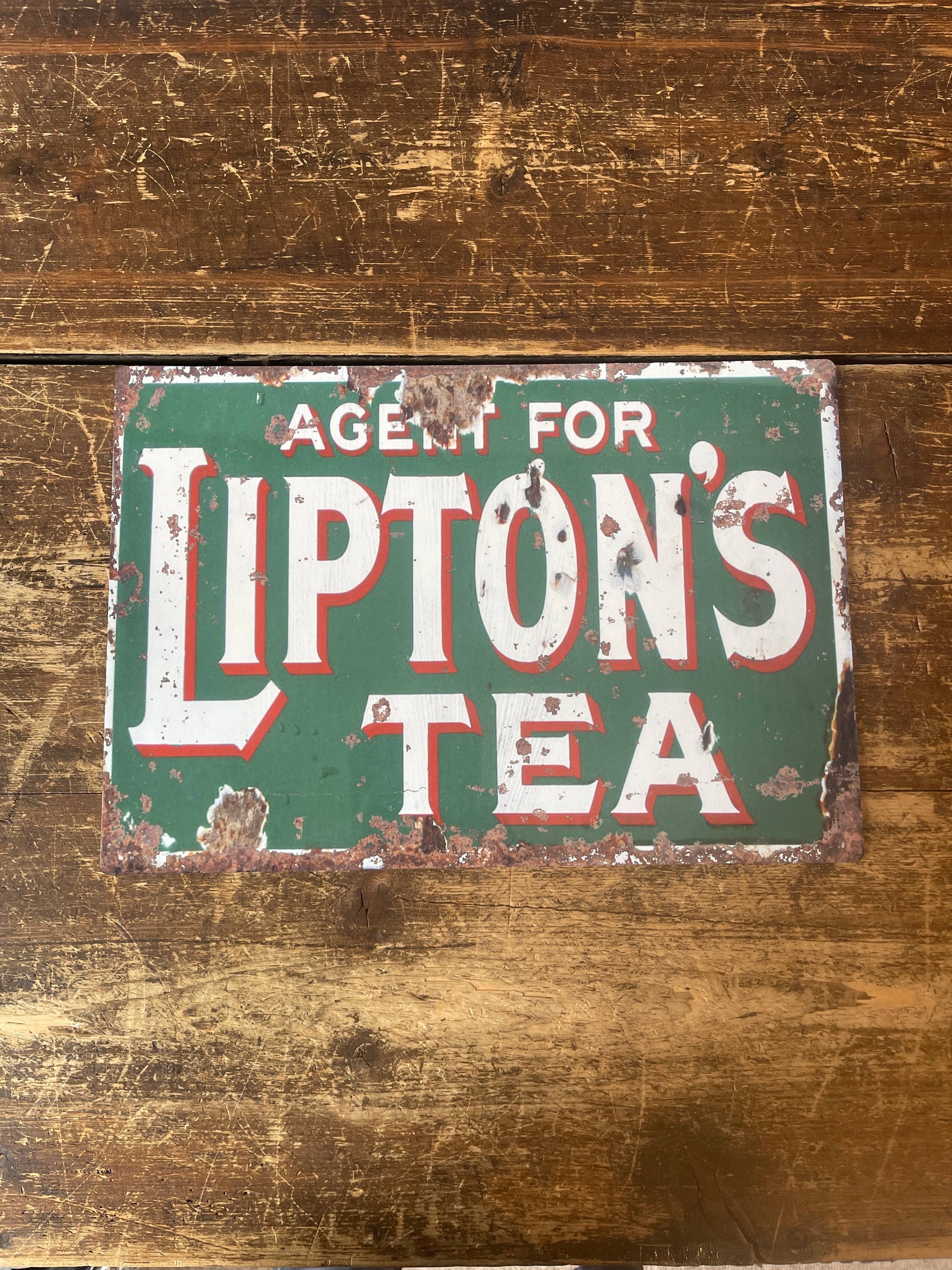 Vintage-Style Lipton's Tea sign on a wooden surface, from Vintage Whippet