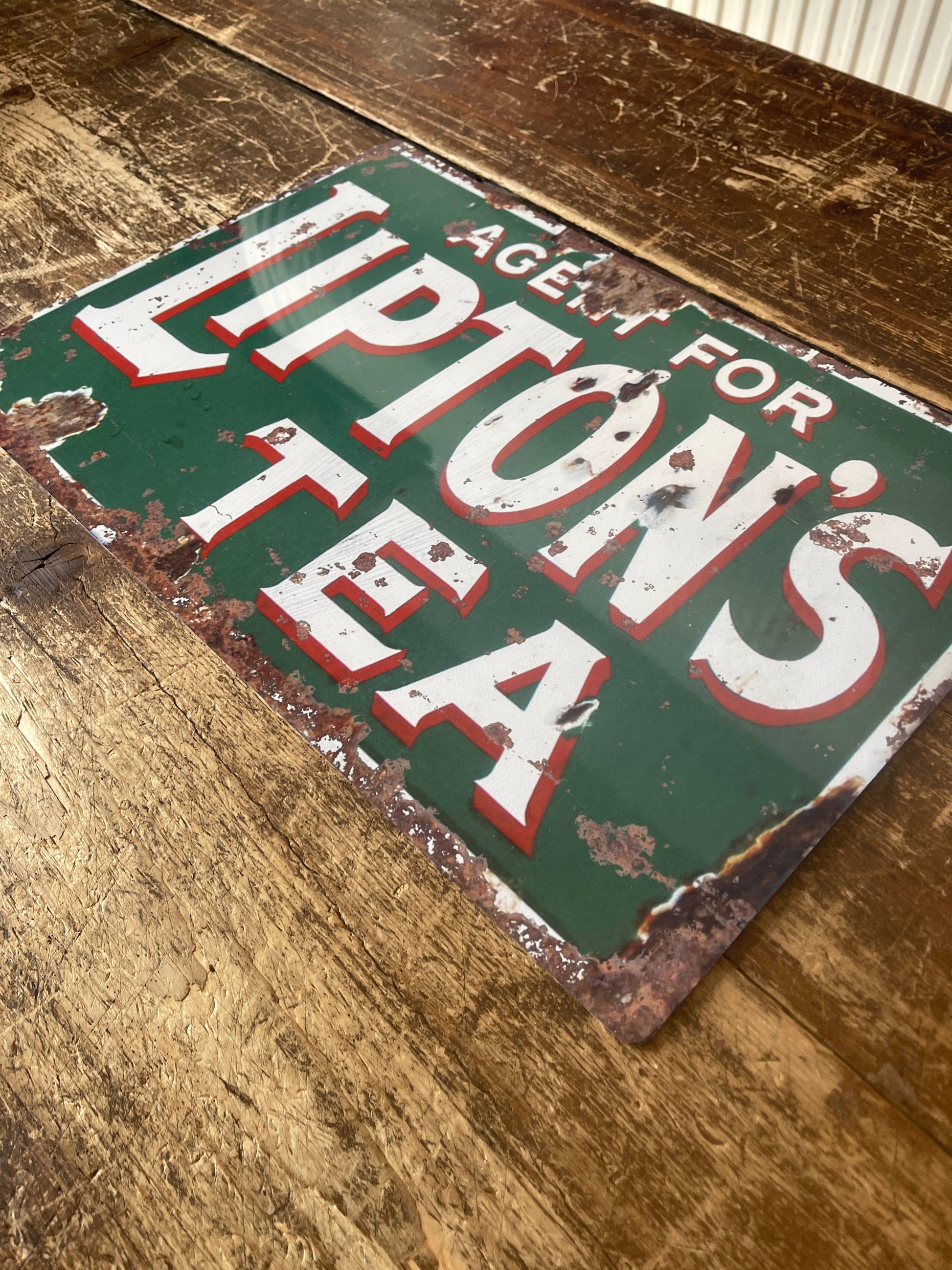 Vintage-Style Lipton's Tea sign on a wooden surface, from Vintage Whippet