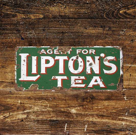 Vintage-style sign for Lipton's Tea on a wooden background, from Vintage Whippet