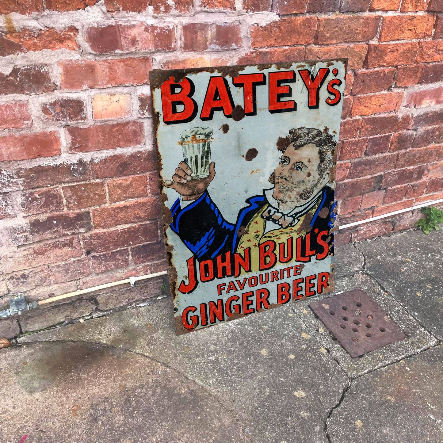 Vintage-Style sign for Batey's John Bull's Ginger Beer against a brick wall, from Vintage.Whippet