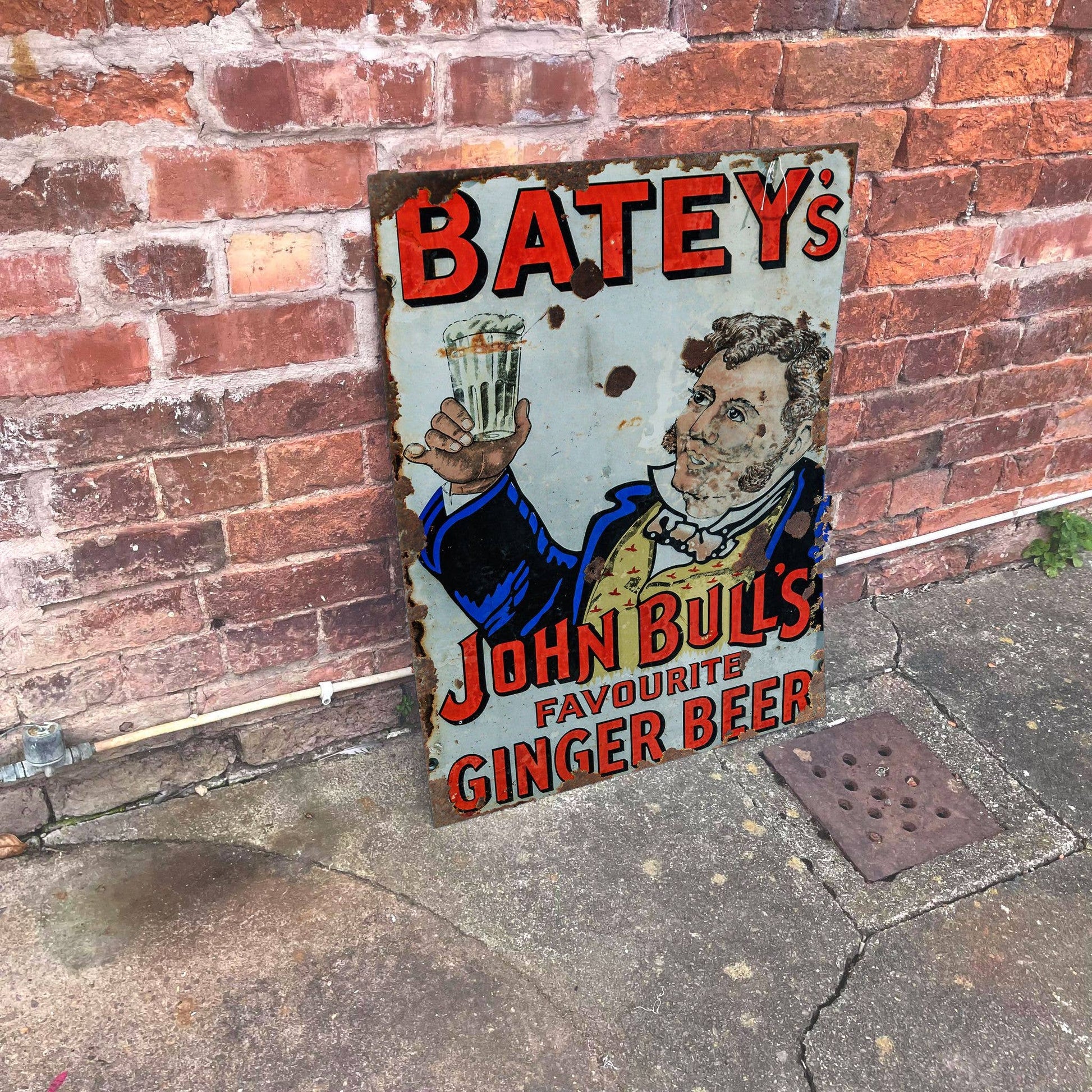 Vintage-Style sign for Batey's John Bull's Ginger Beer against a brick wall, from Vintage.Whippet