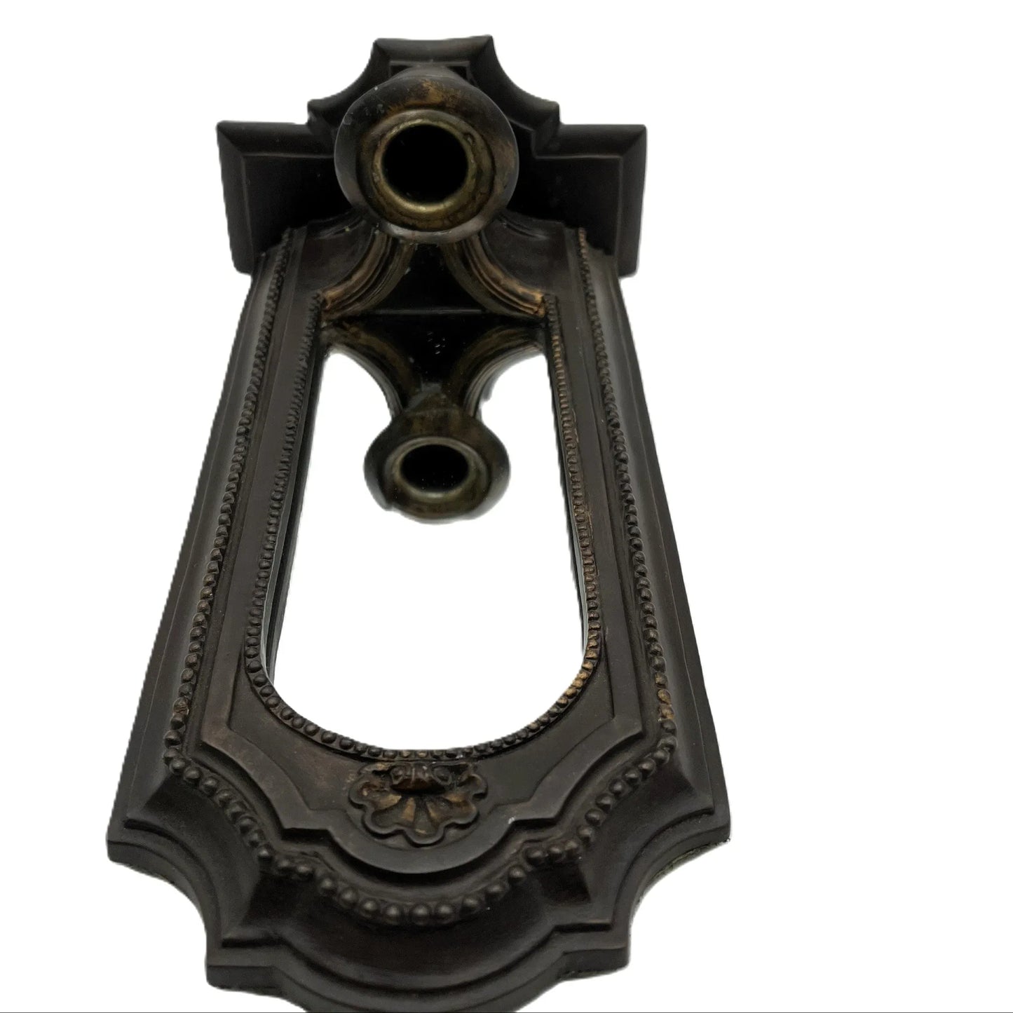 This is a used heavy, vintage-style mirrored wall candle sconce in a bronze-like finish. It has lovely detailing with worn gold accents. It has a felt back with a ring for hanging.