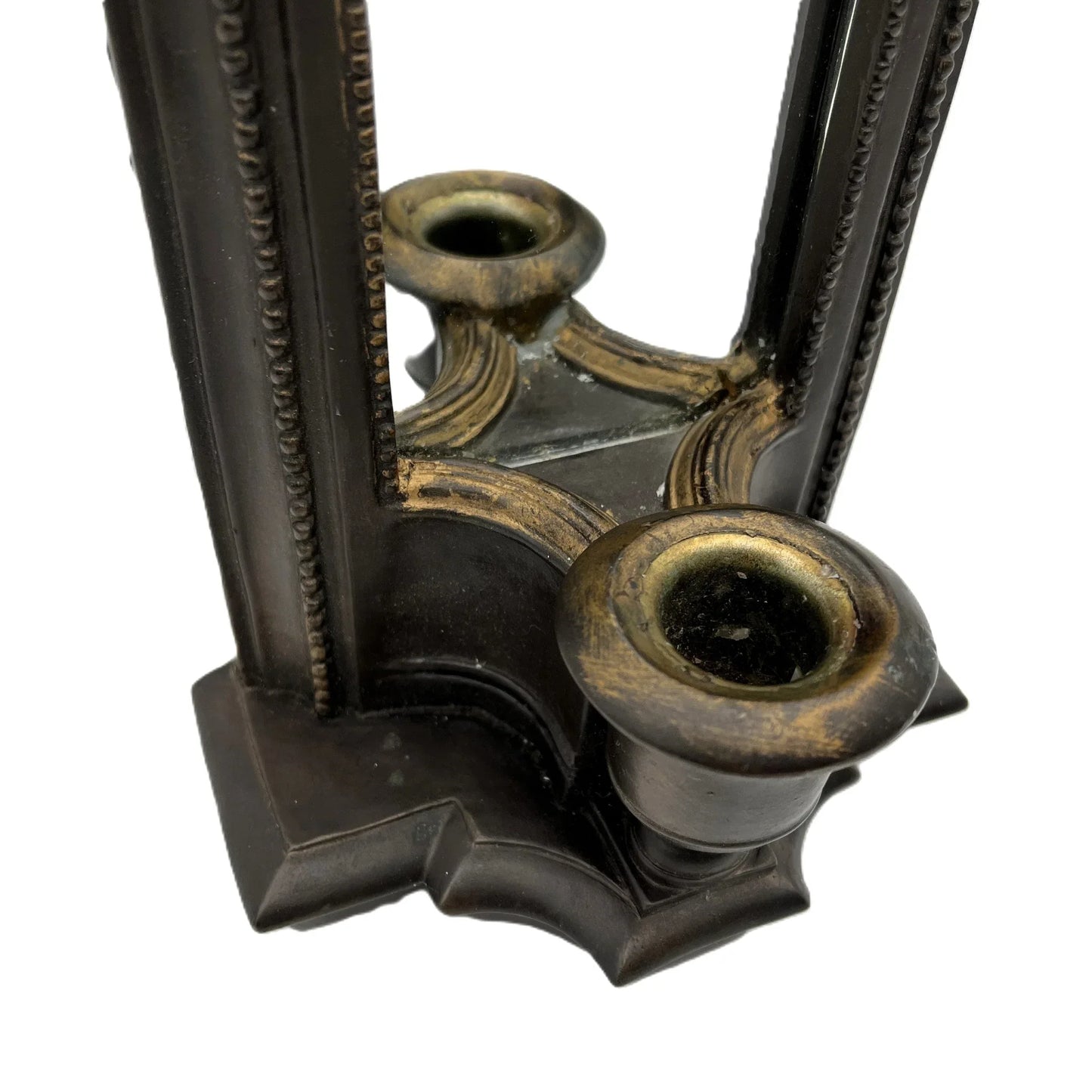 This is a used heavy, vintage-style mirrored wall candle sconce in a bronze-like finish. It has lovely detailing with worn gold accents. It has a felt back with a ring for hanging.