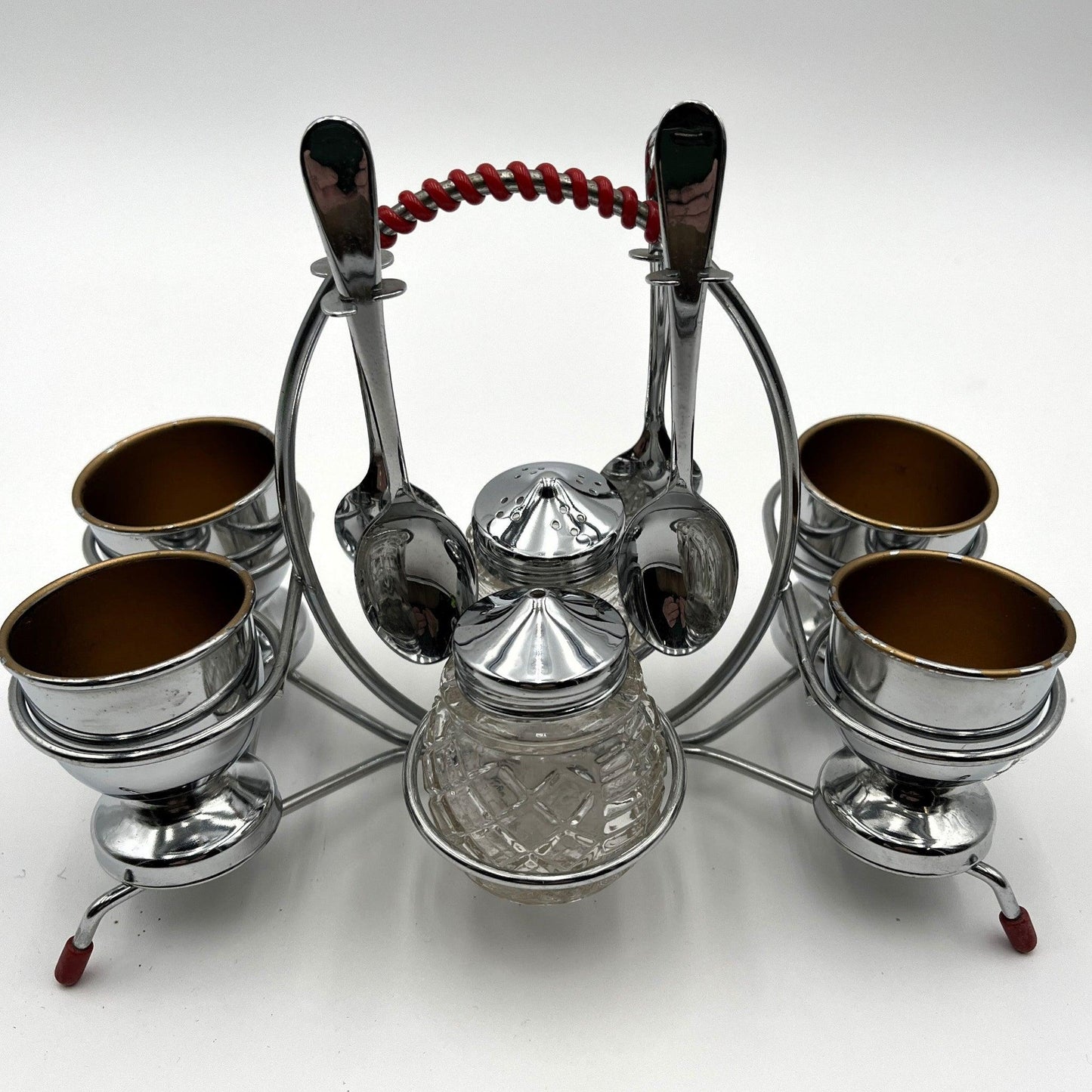 vintage 1960s egg cup holder with 4 egg cups, Salt and Pepper pots and 4 spoons. 