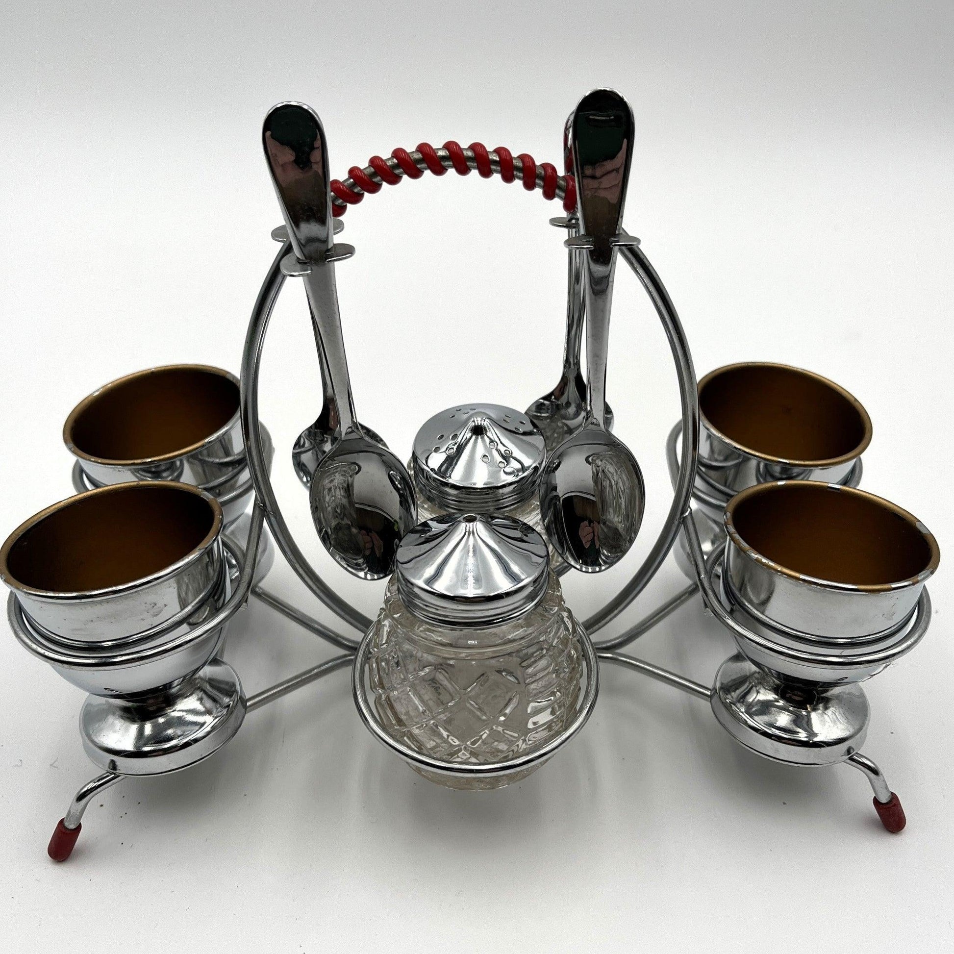 vintage 1960s egg cup holder with 4 egg cups, Salt and Pepper pots and 4 spoons. 