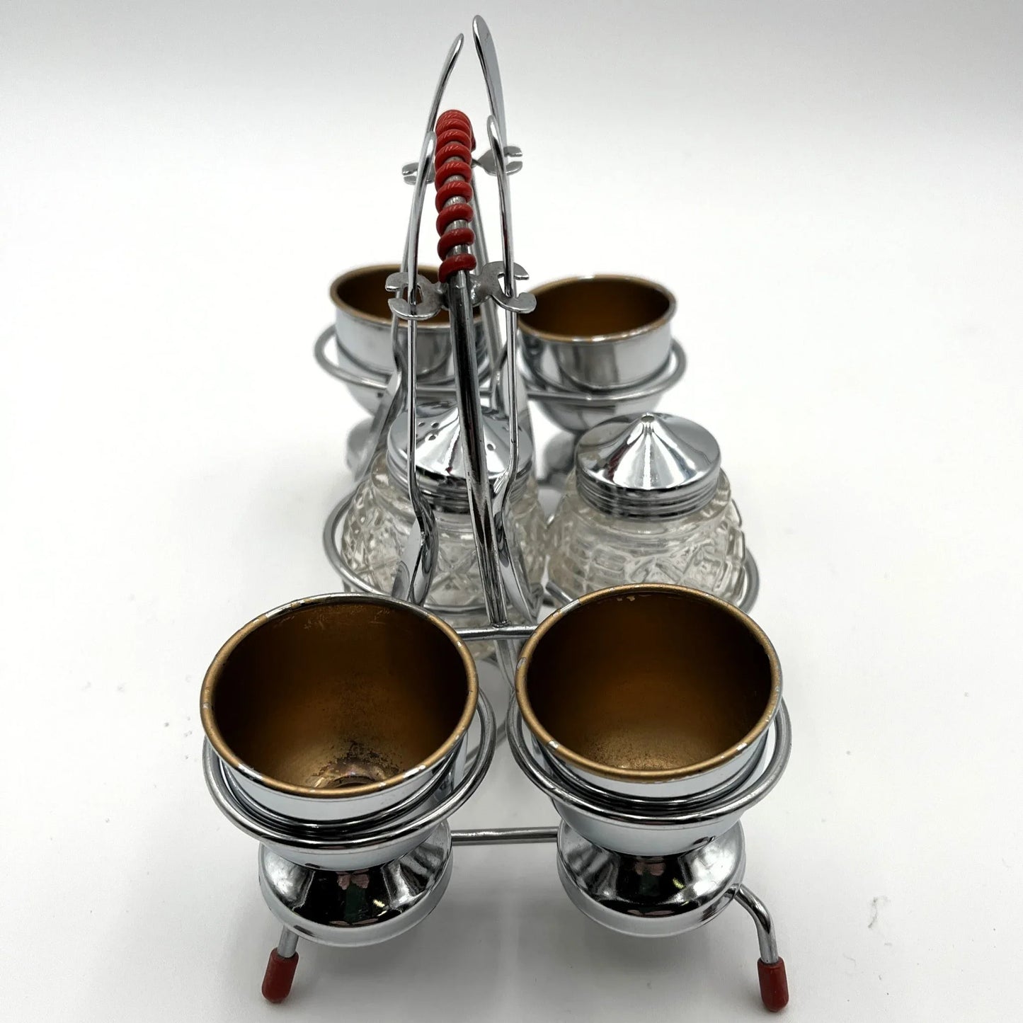 vintage 1960s egg cup holder with 4 egg cups, Salt and Pepper pots and 4 spoons. 