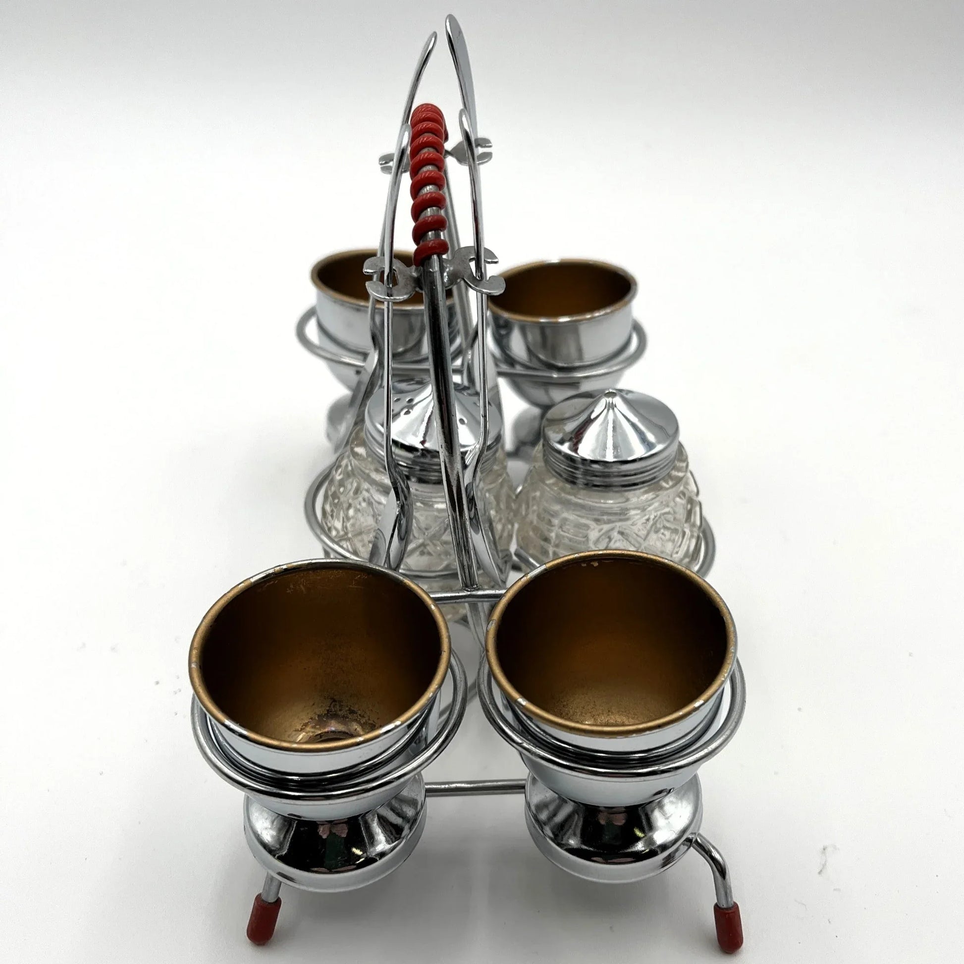 vintage 1960s egg cup holder with 4 egg cups, Salt and Pepper pots and 4 spoons. 