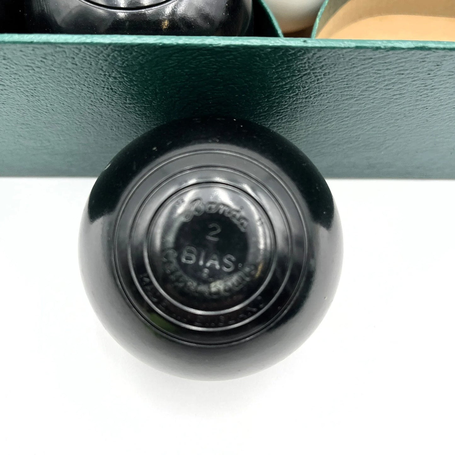 This is a vintage B&A Home Carpet Bowls set, a miniaturized version of lawn bowls designed for indoor play. 
Manufactured by the British company Banda, these sets are often considered collectibles. 
