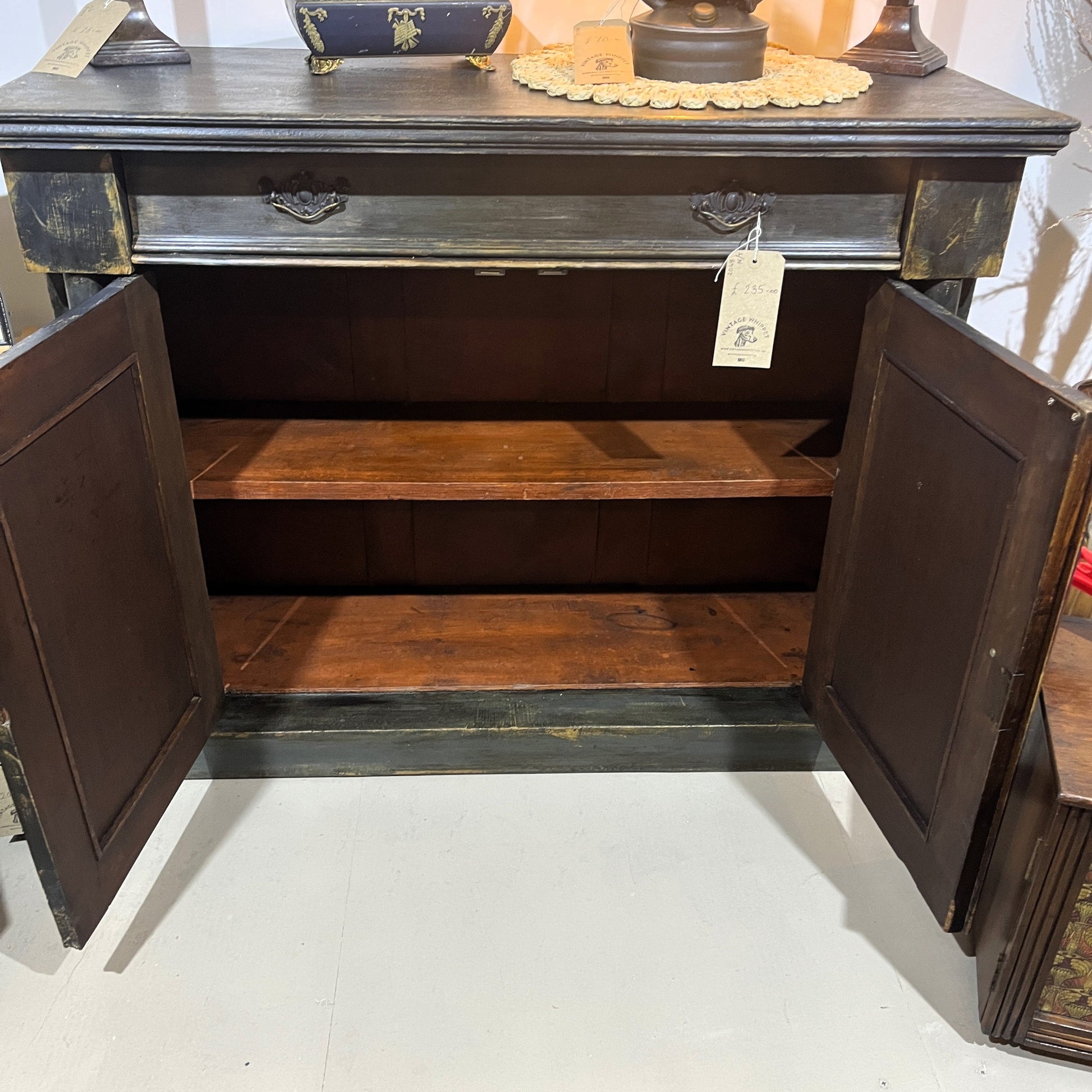 This is an old vintage painted sideboard. It has been cleaned inside and out, properly prepared, and the exterior painted with a paint finish to give an aged patina effect.