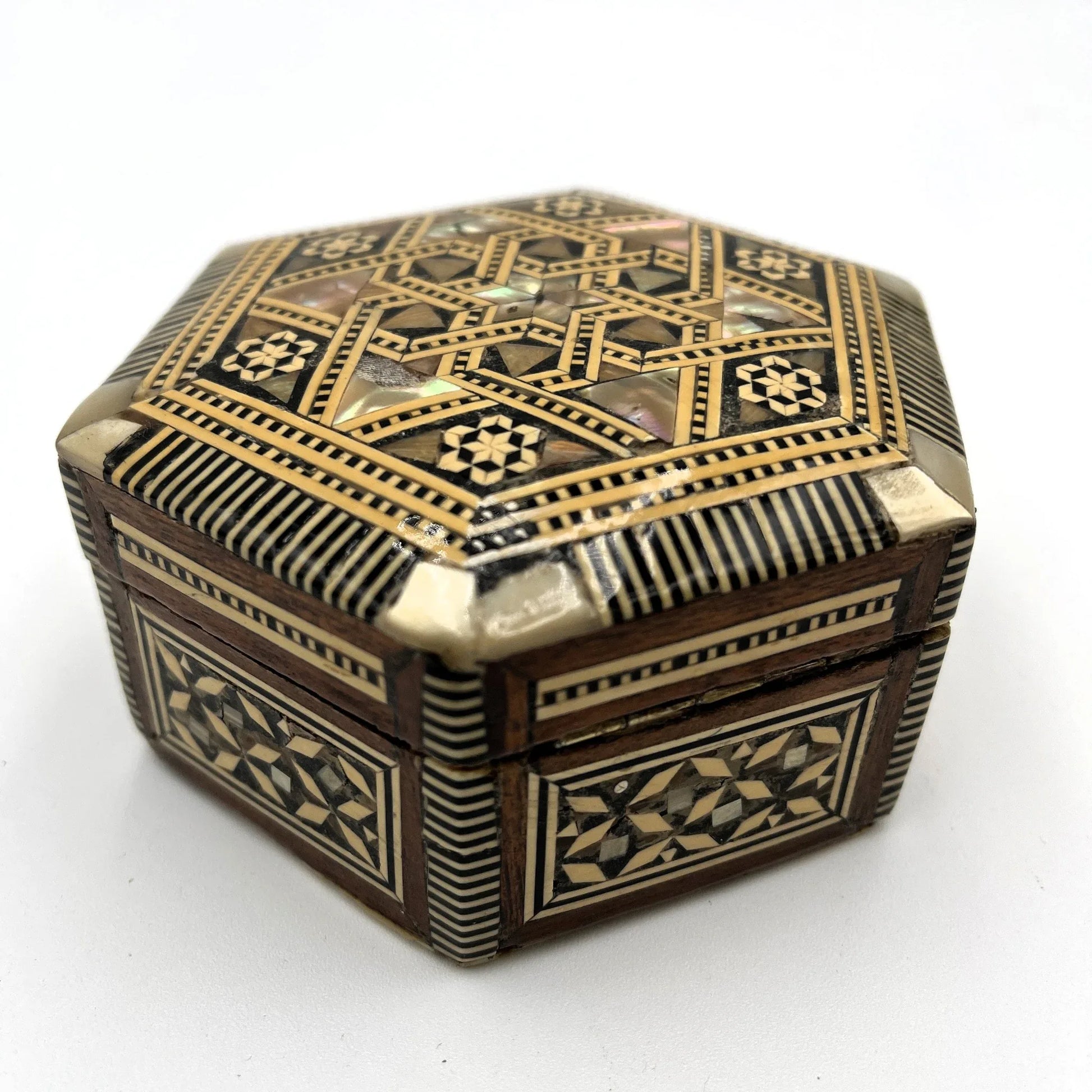 vintage hexagonal mosaic box, traditionally crafted in the Middle East with artisan techniques. 